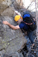 Sketchy rock traverse above deep water