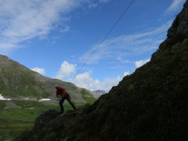 Pulling the wet rope - it is still raining but blue sky in the background...