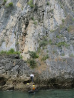 Victor about to help us pull our boat onto the rock to climb a couple of routes above