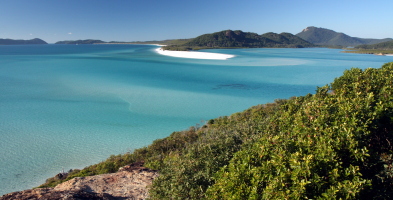 Whitehaven beach at high tide. At low tide, it's almost all white sand underneath the shallow water!