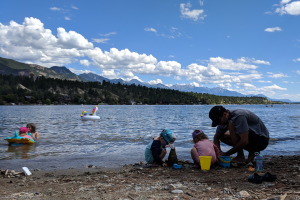 Building a sand castle, while the girl on the left in the background unknowingly picks up some leeches! Lake Windermere definitely has leeches (she picked up a dozen including a huge one on her back)