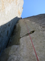 Nearing the end of pitch 4. It's a weird mantle on a spooky and huge detached block (hope it stays!)