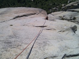 Melissa belaying on the 5.8 slab pitch