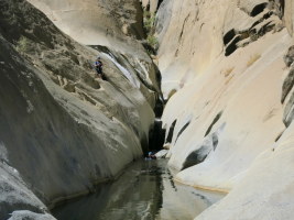 A couple finishing their descent - the last rappel