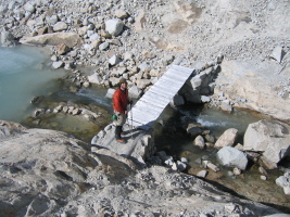 Stewart crossing a bridge on the way to the flat Paron glacier, on our afternoon scoping out of the route