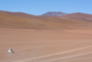 A tiny LandCruiser in the vast desert