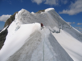 climbing the knife edge snow ridge