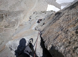 Melissa sitting on the flake with the short 5.10 fingers section below