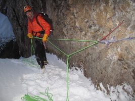Rappelling down the ice step in the gully